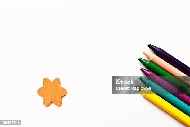Diagonal Row Of Bright Crayolas Plus Star On White Background Stock Photo -  Download Image Now - iStock