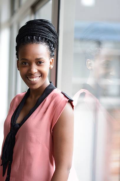 istock Smiling African woman and her reflection 180847640