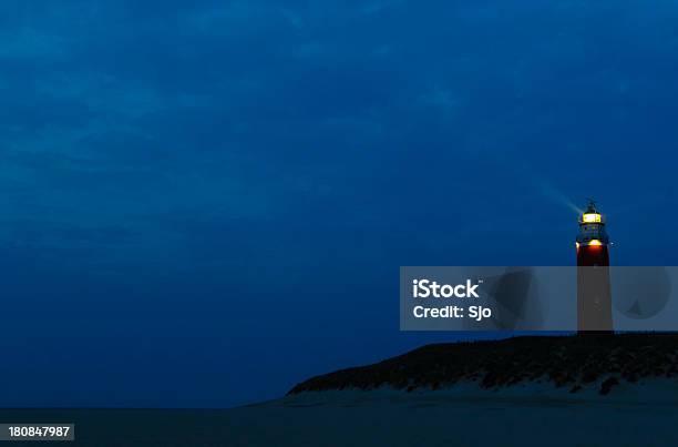 Lighthouse On A Dune Stock Photo - Download Image Now - Lighthouse, Night, Beacon