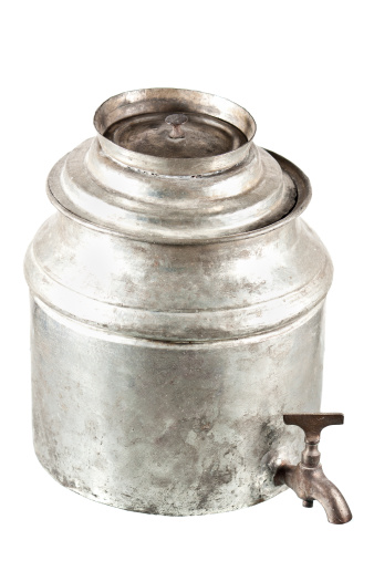 Silver Brass Old Vintage metal Traditional Russian Teapot samovar isolated on white. Folk utensils for tea drinking, water boiler.