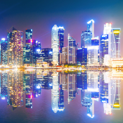 The Central Business District of the Marina Bay urban landscape in Singapore at twilight.