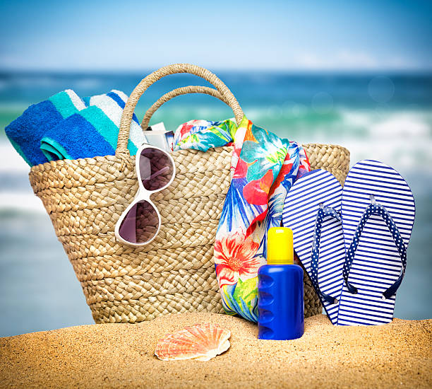 Summer Beach Holiday Everything you need for a day at the beach beach bag stock pictures, royalty-free photos & images