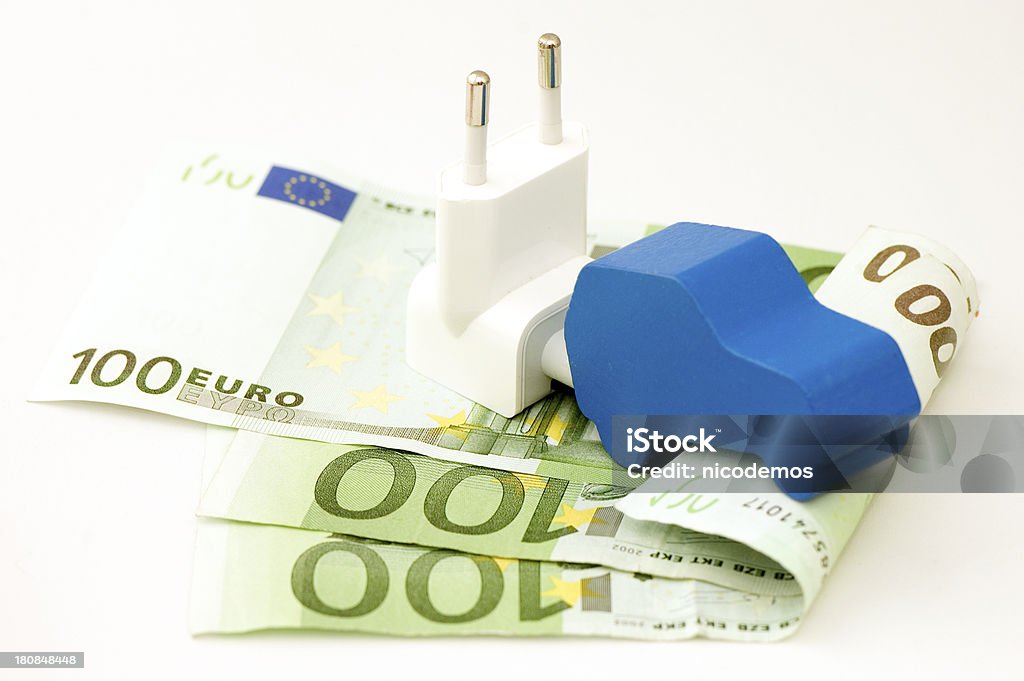 Wood Car on 100 Euro Banknotes. Red wood Car sitting on 100 Euro Banknotes. White Background. Electric Car Stock Photo