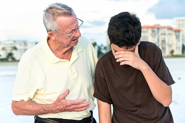 istock Grandfather scolding his grandson 180848739