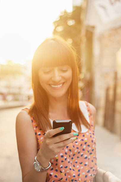 istock Beautiful girl using smart phone 180848790
