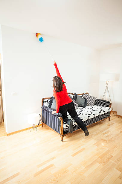 istock Mature woman cleaning her home 180849265