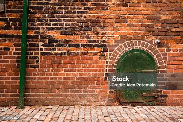Old Red Brick Wall With A Green Door Stock Photo - Download Image Now - Abandoned, Backgrounds, Brick