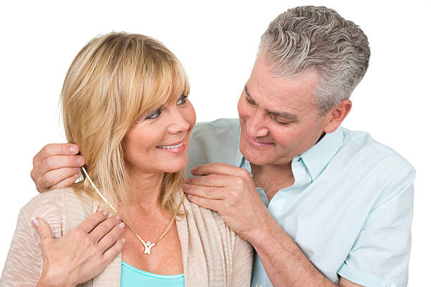 Love, family and people concept: lovely happy couple hugging over white background.