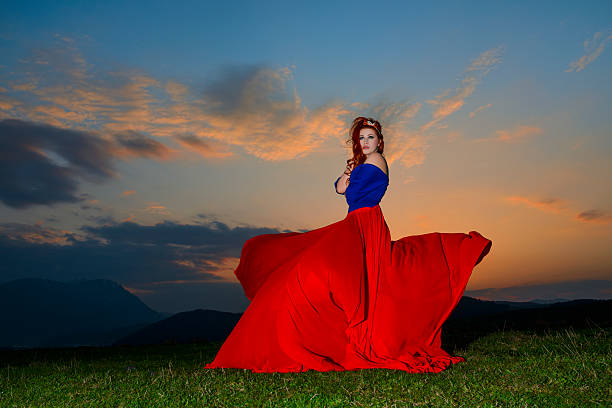 istock woman in red dress 180849959
