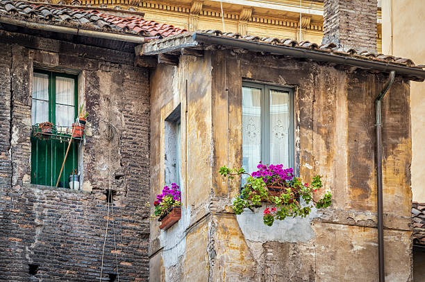istock Idyllic windows with potted plants in Rome, Italy 180850613
