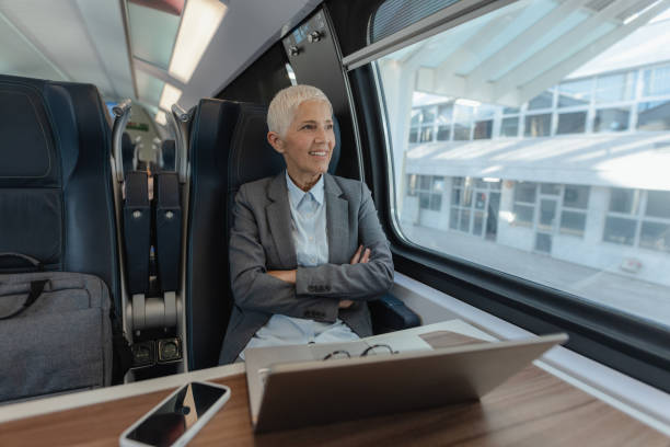 istock Senior businesswoman enjoying train ride 1808531221