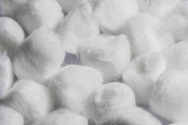 istock Pile of white cotton balls 180855385