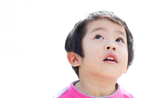 istock Little Girl Looking up 180855630