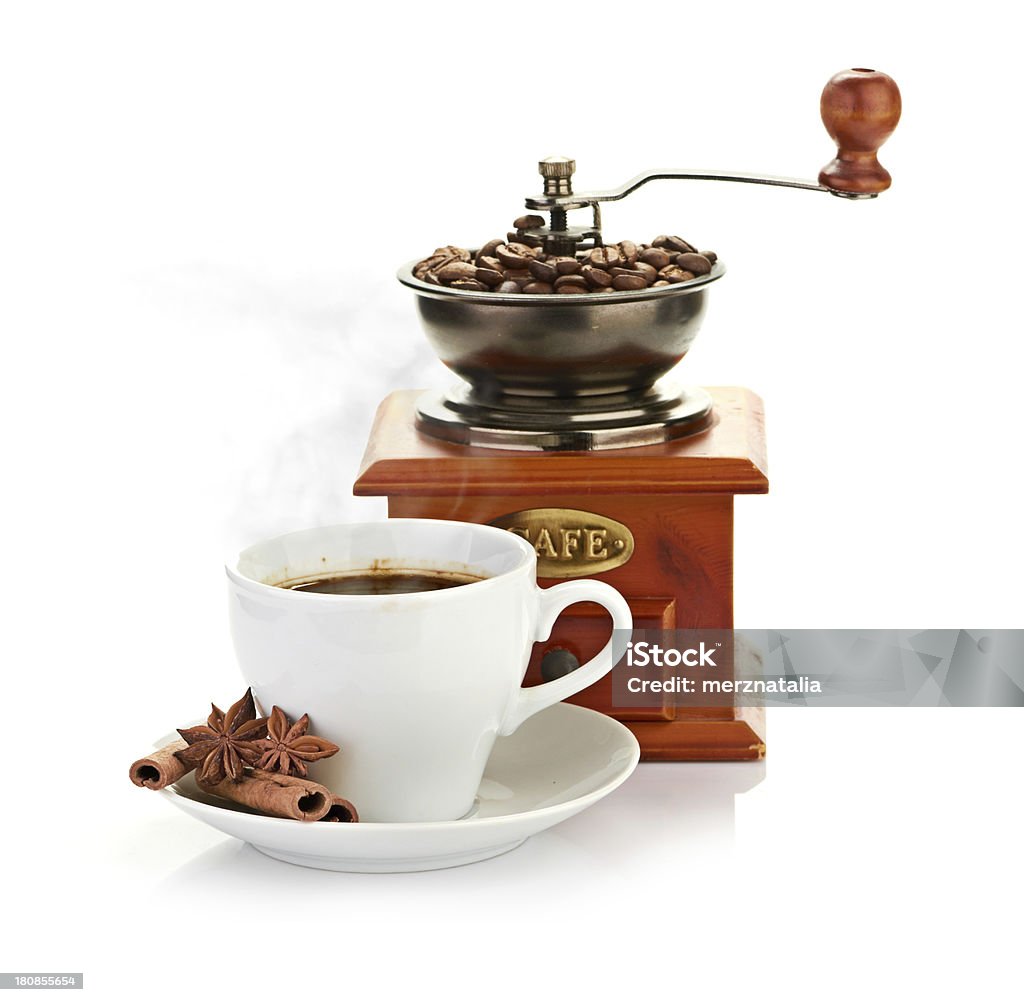 wooden coffee grinder coffee beans with wooden coffee grinder and coffee cup. Breakfast Stock Photo