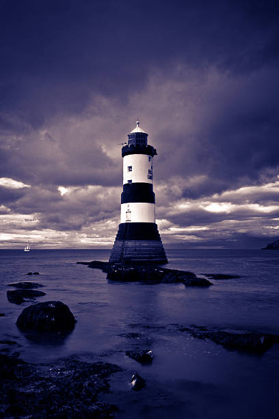 Lighthouse at dusk stock photo