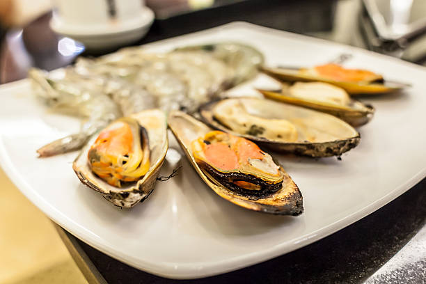 istock Grilled mussels on white dish 180859484