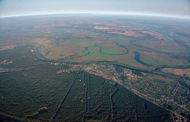 istock Aerostats in the air over fields and river. 180859822