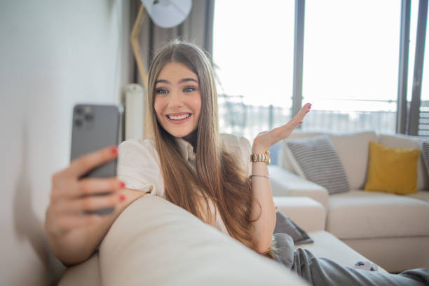 istock Happy young woman using phone 1808601502