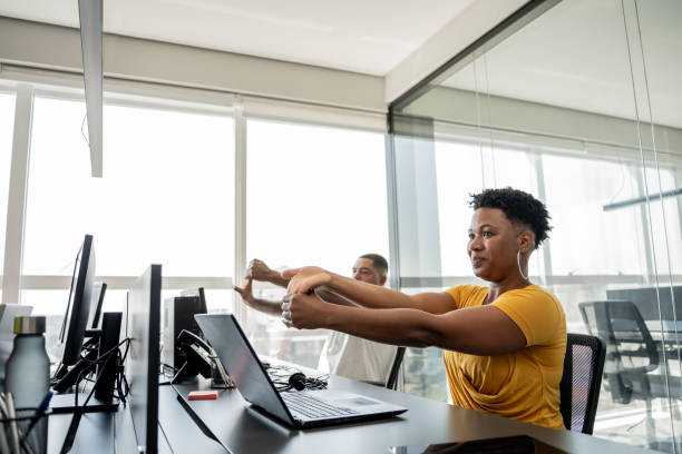 Black woman exercising in the office