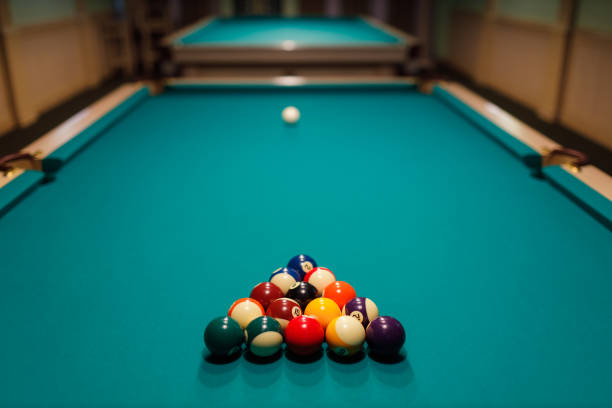 istock Billiard accessories balls and cue on a billiard table 1808603753