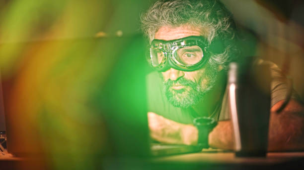 Pro gamer playing online video game with aviator goggles.