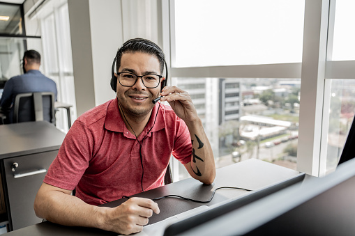 Portrait of Asian man working with call center