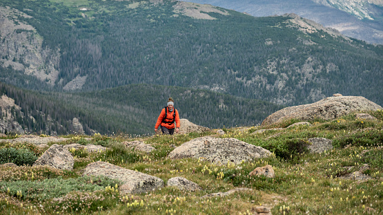HIker Emerges From Below The Pass At Stormy Peaks in Rocky Mountain National Park