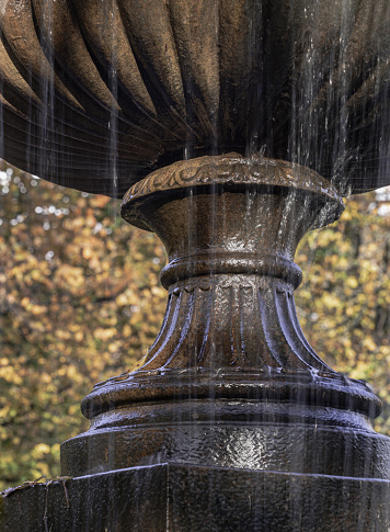 Detail of The tiered water fountain statues in Regentâs park. which creates aesthetic atmosphere, Classic style stone fountain with flowing water, Vintage fountain, Copy space, Selective Focus.