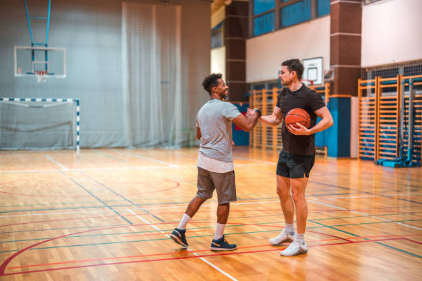 istock Diverse Basketball Players Shaking Hands In A GYM 1808634733