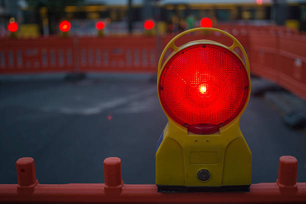 istock Single red traffic warning lamp at night 180864137