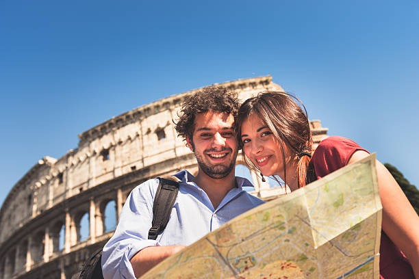 istock tourist with map at rome - coliseum 180864161