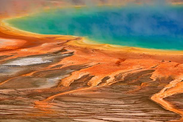 Nighttime at Yellowstone Grand Prismatic Spring with stormy clouds in the background