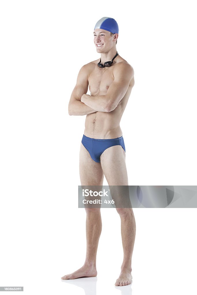 Uśmiech mężczyzna Pływak stałego z Skrzyżowane ręce - Zbiór zdjęć royalty-free (18-19 lat)