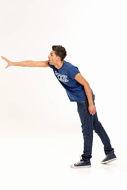 istock Young guy about to grab something in his hand 180865118