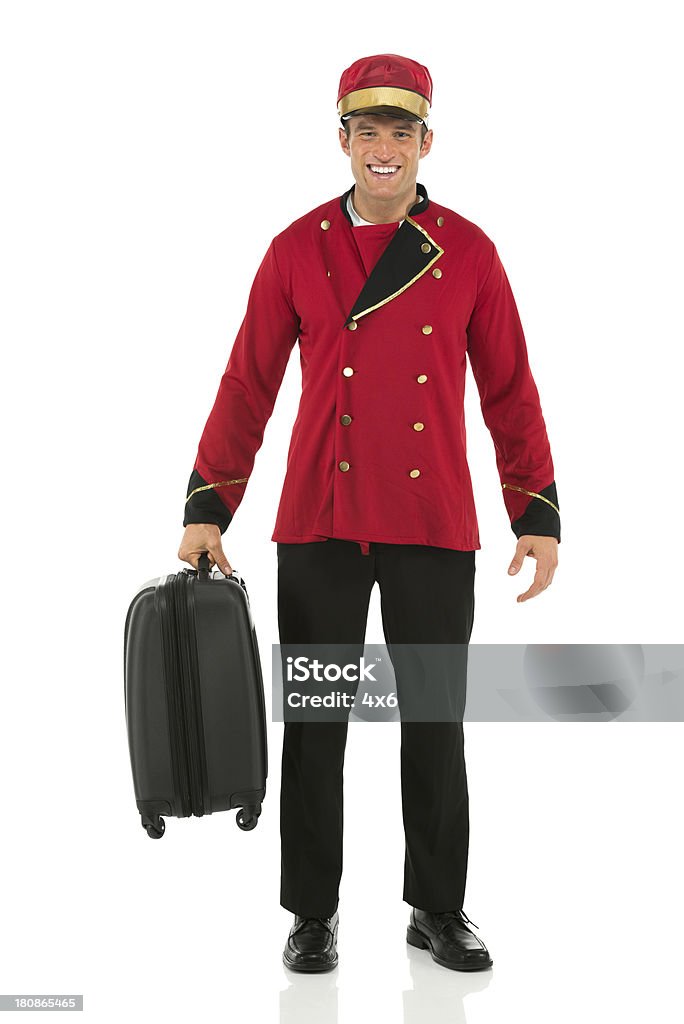 Sorridente Assistente con una valigia - Foto stock royalty-free di Adulto