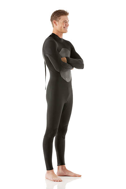 istock Smiling young man in wetsuit with arms crossed 180866536