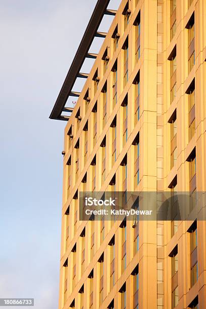 Stone Building Exterior With Windows Near Sunset Stock Photo - Download Image Now - Architecture, Building Exterior, Built Structure