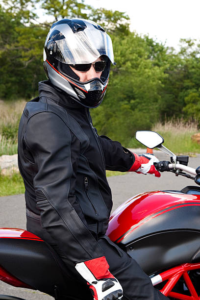 istock Biker sitting on Sport Motorcycle wearing helmet 180866931