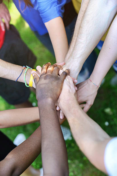 istock Diverse hands together outdoors 180868930