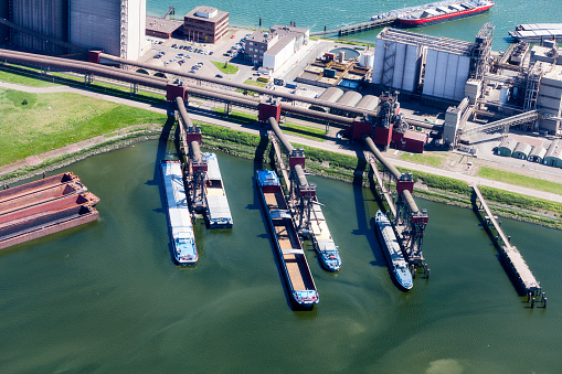 Aerial of inland ships loading cereal