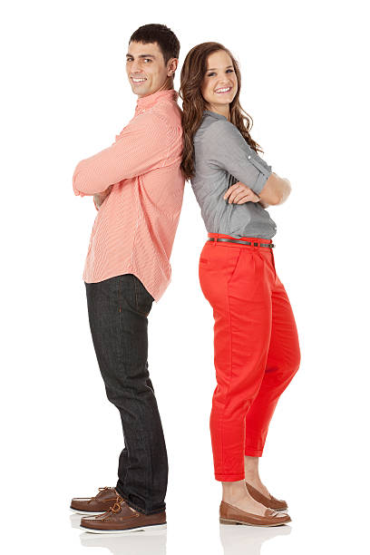 istock Young couple standing with backs to one another 180868952