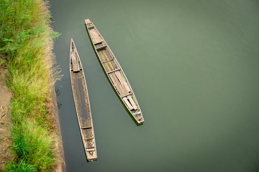 Wooden canoes used on Asian rivers for fishing and has living quarters in Asian lakes and rivers Thailand Asia