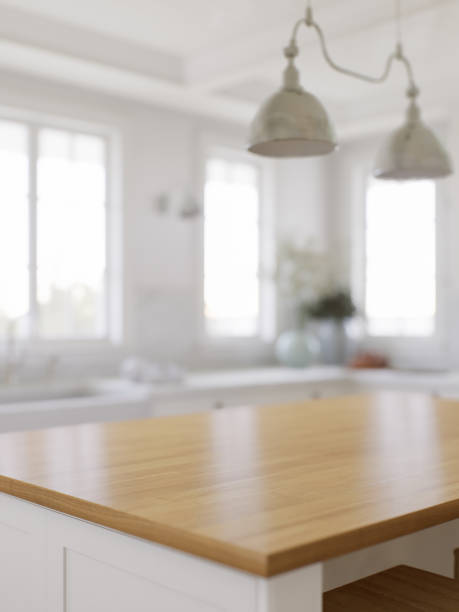 istock Wooden countertop, empty surface to place your goods, with a blurred kitchen background in the background. Stylish, bright kitchen in traditional style. 3D rendering 1808725621