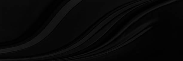 istock Black gray satin dark fabric texture luxurious shiny that is abstract silk cloth background with patterns soft waves blur beautiful. 1808753639