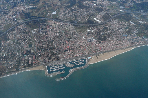 Sanremo, Italy. Aerial view of city port and skyline on a sunny afternoon