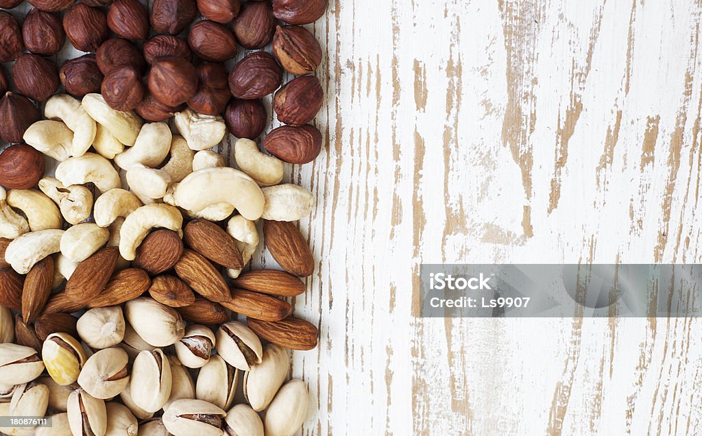 Mixed nuts Mixed nuts on a old wooden background - Nuts  frame Almond Stock Photo