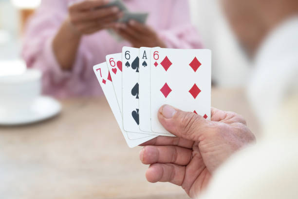 istock Elderly person play cards. 1808764074