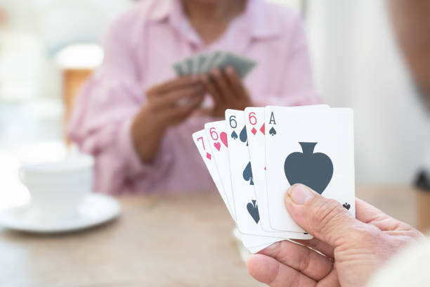 istock Elderly person play cards. 1808765620