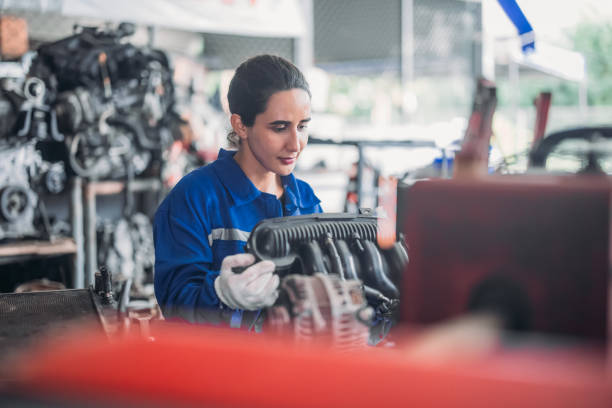 istock Car technician check engines, choose quality gear for precise repairs to ensure optimal performance 1808789718