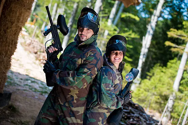 Photo of Paintball players posing to the camera